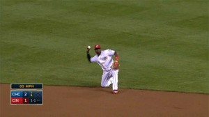 Brandon Phillips dives to his right to snag a sharp grounder and throws to first from his knees for the out.