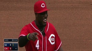Brandon Phillips charges a ground ball hit by Everth Cabrera and makes a barehanded throw to first to get the out.