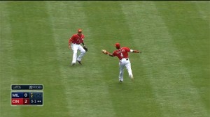 Brandon Phillips runs down a popup, making a catch over his shoulder in shallow center field.