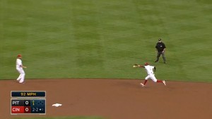 Brandon Phillips ranges up the middle to snag a ground ball off the bat of Travis Snider and makes a jump-throw for the out.