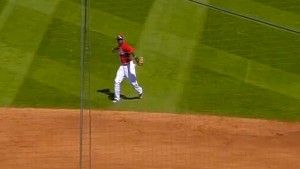Brandon Phillips grabs a bouncing ground ball with his bare hand and throws to first for the out. 