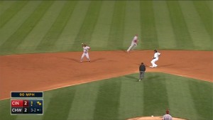 Brandon Phillips ranges far to his right and makes the off-balance throw from short to get Jose Abreu at first base.