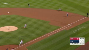 Brandon Phillips slides to stop a grounder off the bat of Kolten Wong, then gets to his feet and throws to first for the out.