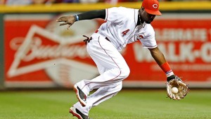 Brandon Phillips makes a diving stop on Mike Moustakas' ground ball and throws from his knees to get the out at first in the 12th.